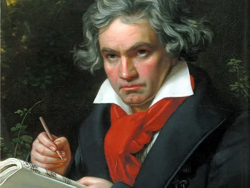 Portret Beethovena, geniusza muzyki, pochylonego nad nutami. Jego wzrok pełen pasji, a dłoń z ołówkiem gotowa do tworzenia.